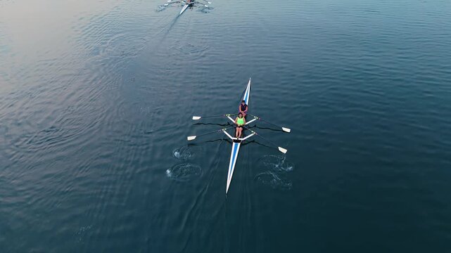 Watch a team of dedicated young women athletes as they skillfully navigate the tranquil waters of Halifax Ocean Bay, showcasing teamwork and athleticism in their rowing boat