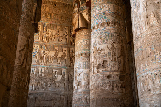 Epic Dendera temple ancient Egyptian architecture interior panorama. 
Cinematic view of historic limestone columns with carved pharaoh hieroglyphs, 
Goddess Hathor relief pillars and antique stone wal