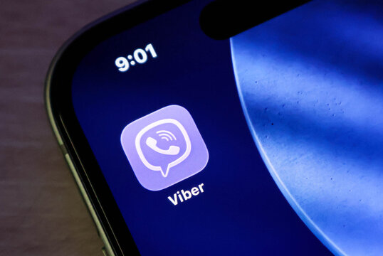 Closeup of the viber app icon on a smartphone screen, displaying the messaging and calling application logo on a digital display
