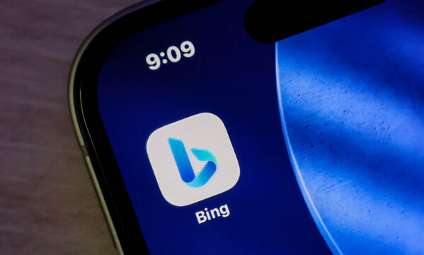 Closeup of the microsoft bing search engine app icon displayed on a modern smartphone screen with a dark blue background