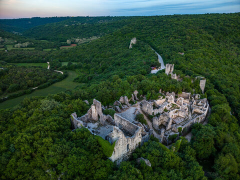 Aerial view of the medieval Dvigrad ruins surrounded by dense green forest and rolling hills in Kanfanar, Istria County, Croatia.