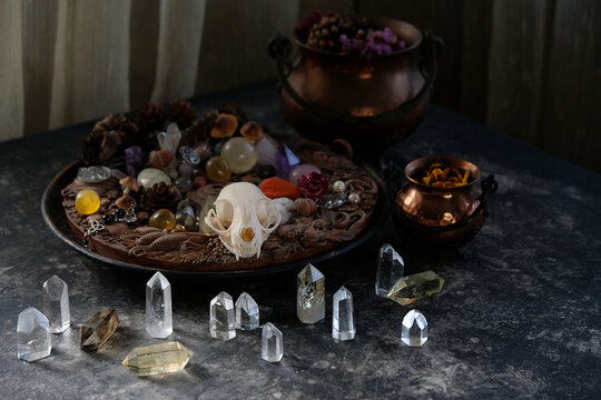 witch altar. amulets, talismans, copper cauldrons, crystals, witchery stuff on dark table. Practical Magic, witchcraft. esoteric spiritual ritual for relax, meditation. witchy workplace. litho therapy