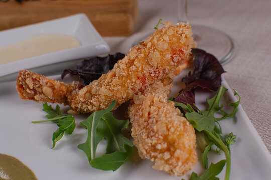 Breaded Fried Seafood Appetizer with Salad and Dipping Sauce