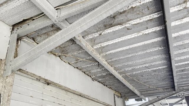 Modern industrial building roof construction with lightweight steel truss and galvalume sheets
