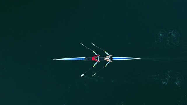 Top View Two men navigate the serene waters of Halifax Ocean Bay, showcasing teamwork and skill in a thrilling rowing experience. The aerial view captures their dynamic movements amidst the vast ocean