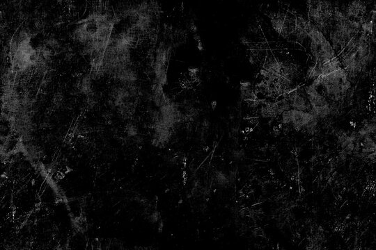 Severely scratched black metal surface with heavy scuffs and wear patterns providing realistic grunge texture for industrial designs and vintage photographic manipulation.