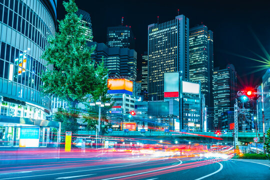 Night city street with light trails in Shinjuku, Tokyo