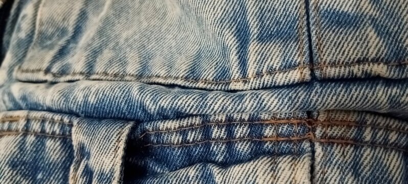 photograph of the texture of the denim backpack