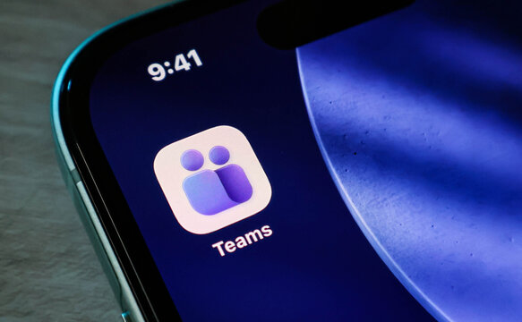 Closeup of the microsoft teams app icon on a smartphone screen, showcasing the modern purple logo design on a mobile device display