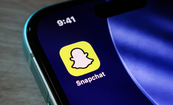 Closeup of the snapchat application icon on a smartphone screen