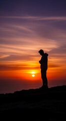 Fototapeta premium Silhouette of a person silhouetted against a sunset with bright sky