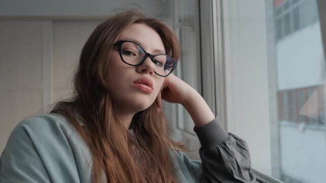 Contemplative lady imagining her aspirations. Focused woman carefully considering her future goals and inner thoughts. Intimate closeup of female writer lost in her reflections and dreams