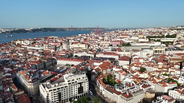 Drone Orbit Above Historic Lisbon at Sunrise