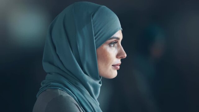 Thoughtful woman in blue hijab looking into the distance peaceful portrait and cultural expression