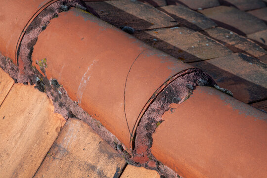 cracked roof tile at the roof ridge