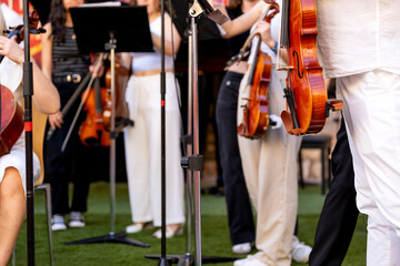 String musicians rehearsing for outdoor classical music concert performance © Alfonso Soler