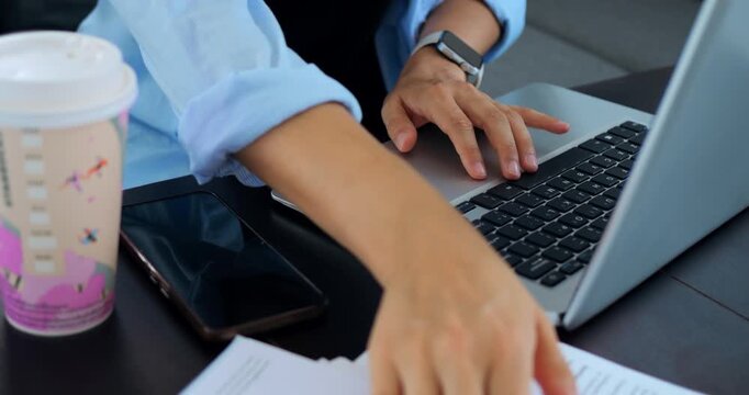 Rapid keyboard movements during late work hours. Frantic typing as critical deadline rapidly draws near. Diligent individual navigating urgent tasks with swift keystrokes and digital alerts