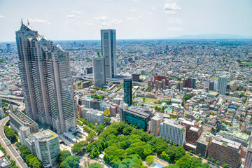 Fototapeta premium Aerial view of Tokyo Shinjuku district skyscrapers and cityscape from high viewpoint sunny day Japan