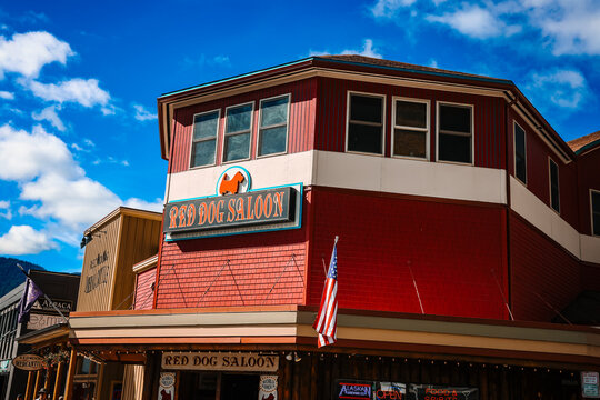The historic Red Dog Saloon building facade with American flag in downtown Juneau, Alaska.