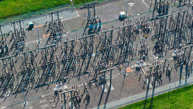 Aerial view of Berkswell Substation National Grid showing a complex network of electrical transformers and steel structures surrounded by green fields Coventry, England, United Kingdom.