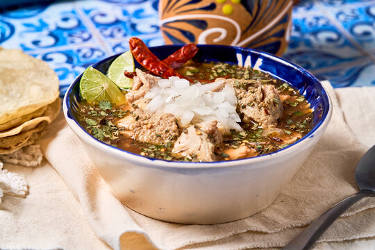 Mexican menudo stew in traditional bowl