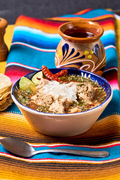 Traditional Mexican menudo soup in a rustic table