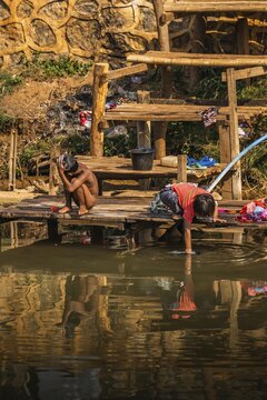 Children washing in the river, lake Inle, Myanmar