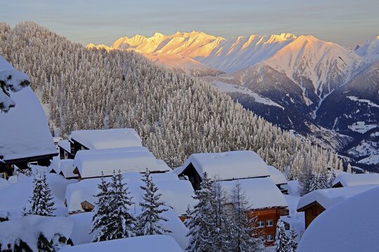 View over deeply snow-covered chalets into the Rhone valley to the Blinnenhorn 3374m and Oberrappenhorn 3176m, Bettmeralp, Aletsch area, Oberwallis, Valais, Switzerland