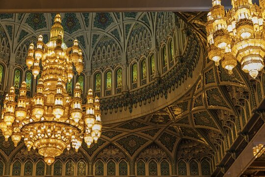 Dome and illuminated chandeliers in the Sultan Qaboos Mosque, Muscat, Arabian Peninsula, Sultanate of Oman