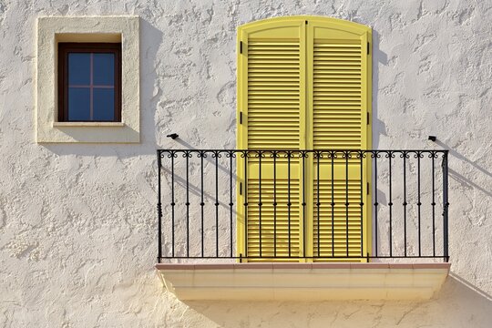 White house facade with a balcony, a yellow balcony door and a small window, Villaricos, Cuevas del Almanzora, Almer&iacute;a province, Andaluc&iacute;a, Spain