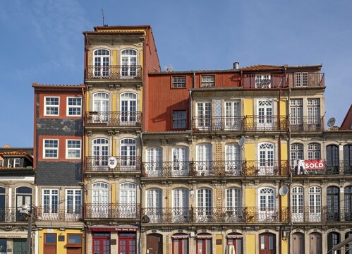 Colorful facades of houses along Cais da Estiva in the Ribeira district, Porto, Portugal