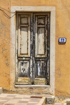 Old weathered front door, Rio Marina, Elba, Tuscan Archipelago, Tuscany, Italy