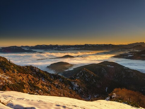 Alpine panorama at sunrise in winter, in the fog valley, Untersberg, Marktschellenberg, Berchtesgadener Land, Upper Bavaria, Bavaria, Germany