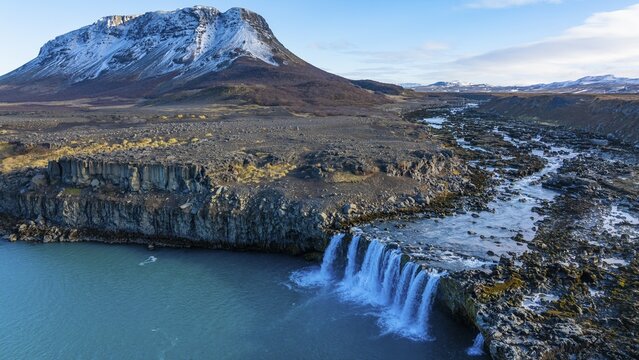 Pjofafoss waterfall, Burfell mountain in the background, drone shot, Sudurland, Iceland