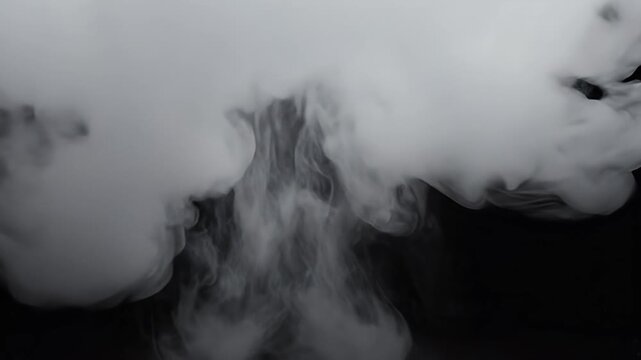 White wisps of smoke billow against a stark black background, creating a dramatic contrast