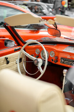 Tykocin, Poland &ndash; May 10, 2025: Interior of a classic Volkswagen Karmann Ghia convertible at a vintage car exhibition. Steering wheel, dashboard, and elegant cabin details.
