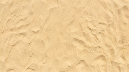 Natural golden sand texture with light organic wave patterns forming a soft and serene background for summer travel themes and commercial design use © Emranul
