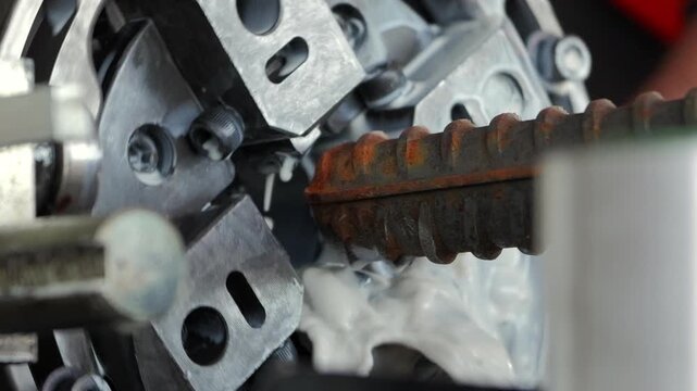 Threaded rebar machining on industrial metalworking machine in slow motion