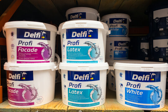 Kyiv, Ukraine, June 27, 2026: Paint Buckets On Shelf: Delfi Profi Facade, Latex, And White Paint For Home Improvement.