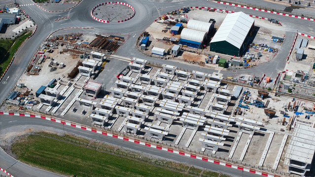 Aerial view of the HS2 Concrete Segment Manufacturing and Production Site with rows of pre-cast bridge components and industrial facilities Birmingham, England, United Kingdom.