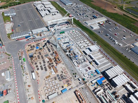 Aerial view of the HS2 Concrete Segment Manufacturing and Production Site with gantry cranes and rows of precast components Birmingham, England, United Kingdom.