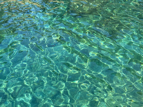 Clear emerald sea water surface.