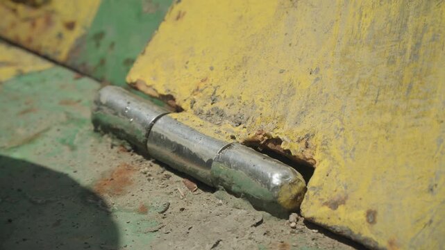 Sharp focus on chipped paint and corrosion. Intimate view showcasing peeling paint and weathered rust surface. Detailed image capturing intricate textures of aged paint and rust on metal surface