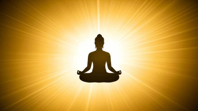 Dark silhouette of buddha meditating in lotus position on radiant golden background. Spiritual journey for peace, enlightenment, and harmony footage.