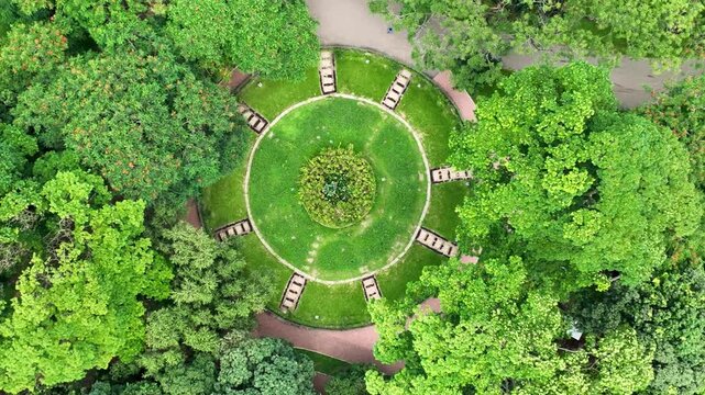 A breathtaking top-down aerial footage of a lush green public park