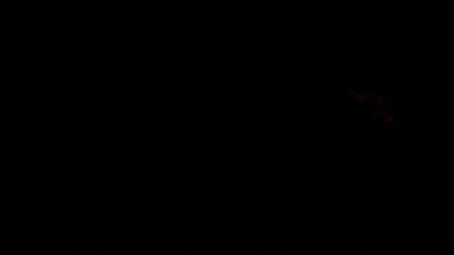 Explosive fire ball isolated on black background.