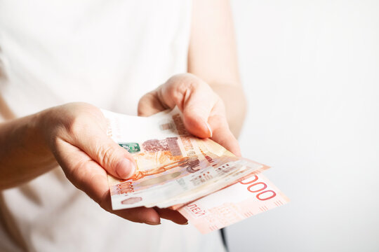 the girl holds in her hands 5000 Russian banknotes 5000 rubles
