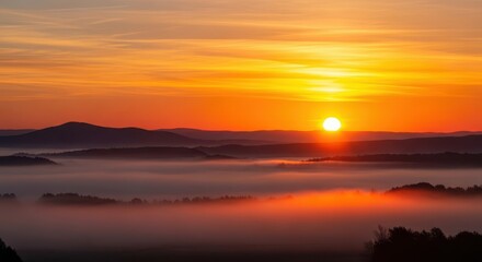 Obraz premium Dramatic golden sunrise over a tranquil misty landscape, highlighting the fiery colors of the morning sky and the peaceful silhouette of the distant hills, hill, fiery, remote
