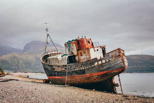 Abandoned shipwreck on the shore of a loch, Scottish Highlands