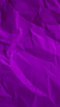 Vertical stop-motion animation of purple wrinkled paper. Seamless loop for cool-toned mobile backgrounds and professional vertical content.